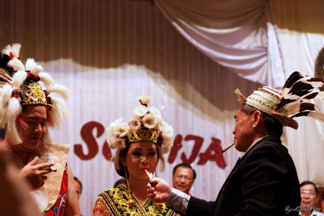 The newly weds are served with the 'jakok' by Temenggong Pahang Ding, the Orang Ulu Paramount Chief. Photo by Alyssa Chin (2012). 